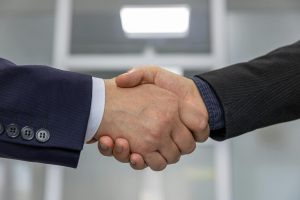 Close-up of a business handshake representing a successful partnership or agreement.